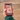 Close-up of a red Xplora phone in a hand showing School Mode on the screen.